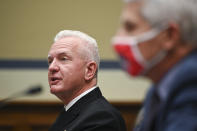 Assistant Secretary for Health, Admiral Brett P. Giroir, speaks as Dr. Anthony Fauci, director of the National Institute of Allergy and Infectious Diseases, right, listens during a House Select Subcommittee hearing on the Coronavirus, Friday, July 31, 2020 on Capitol Hill in Washington. (Erin Scott/Pool via AP)