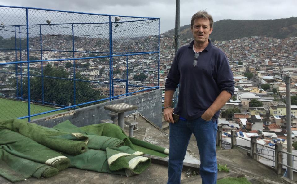 Adam Reid uses football to empower children in the favela district of Penha in Rio.