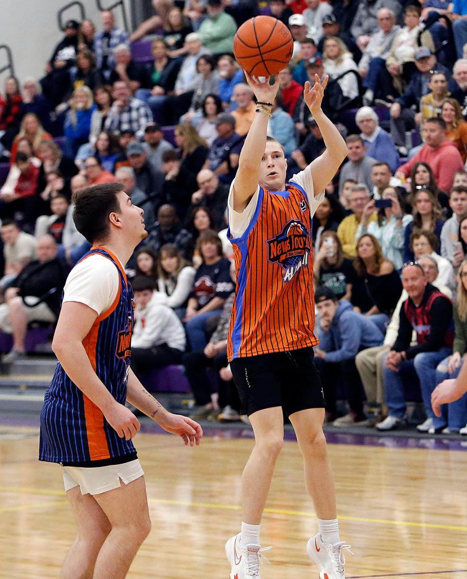 Alumni North All-Stars' Evan Hager (wearing the jersey of his brother, Ethan DeLaney) puts up a shot against South Alumni All-Stars during the News Journal All-Star Classic Friday, March 29, 2024 at Lexington High School. TOM E. PUSKAR/MANSFIELD NEWS JOURNAL