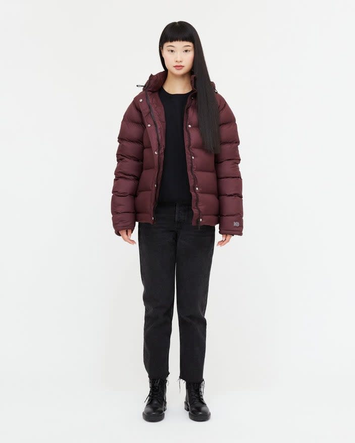 Model wears Cloud Shell Mid-Length Unisex Puffer in marroon