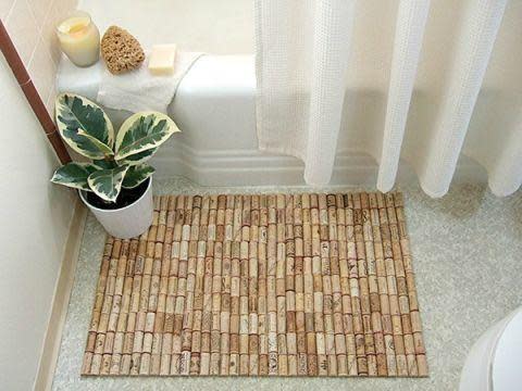 Lend a little earthy texture to your bathroom with this impressive-looking—but easily crafted—shower mat. If you can handle a glue gun, you've got this.
Get the tutorial here.
