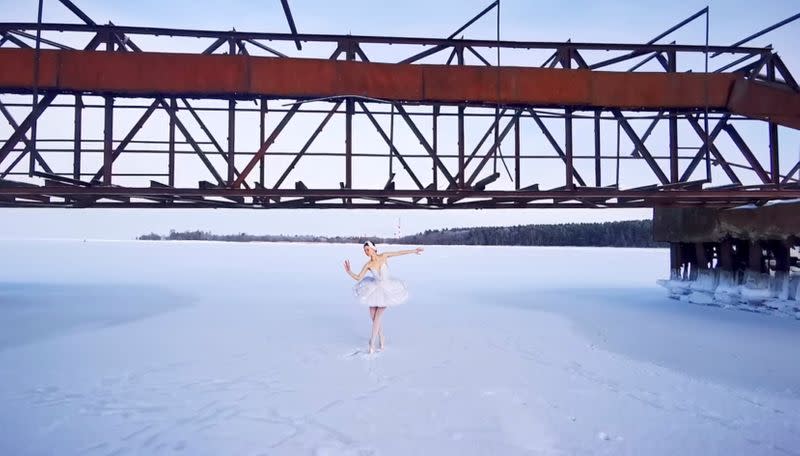 Ballet dancer Ilmira Bagautdinova performs on the ice of frozen Batareynaya Bay in Leningrad region