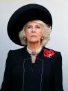 <p>Camilla the Duchess of Cornwall observes <a href="https://www.townandcountrymag.com/society/tradition/g24854110/royal-family-remembrance-day-service-2018-photos/" rel="nofollow noopener" target="_blank" data-ylk="slk:the annual Remembrance Sunday Service;elm:context_link;itc:0;sec:content-canvas" class="link ">the annual Remembrance Sunday Service</a> at the Cenotaph, where the royal family paid respect to the servicemen on the 100th anniversary of World War I. For the somber occasion, Camilla wore a wide brimmed black hat, a pearl choker and earrings, and a black coat with three poppy pins. </p>