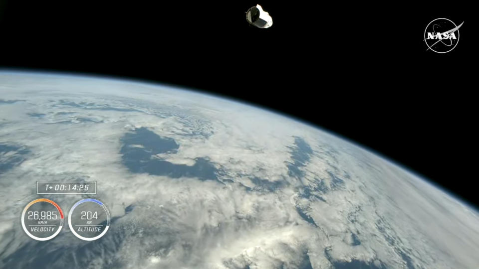 A SpaceX Dragon space capsule above Earth with the black of space in the background for the Crew-9 launch.