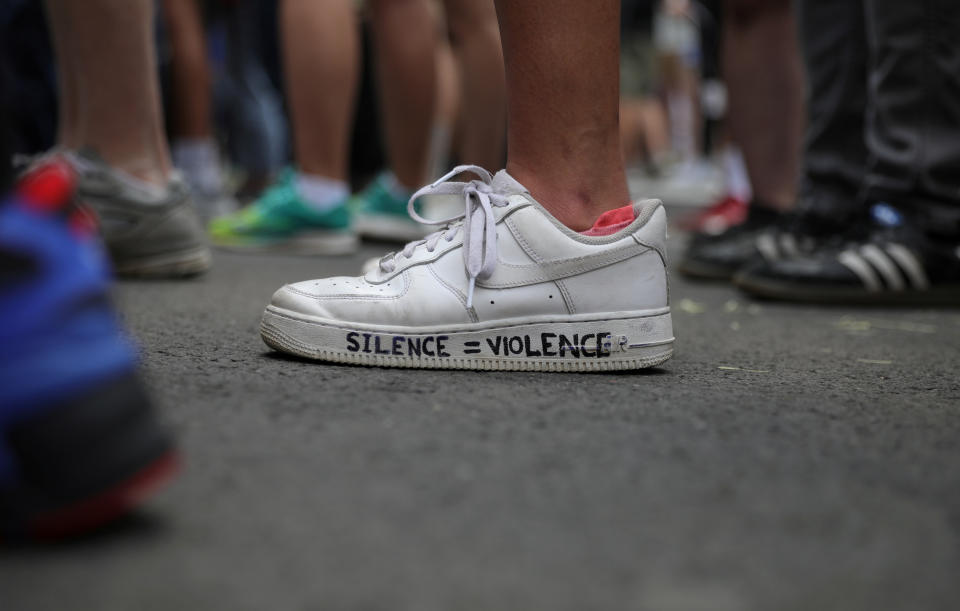 A demonstrator displays a message of protest on shoes as protesters rally against the death in Minneapolis police custody of George Floyd, near the White House in Washington, U.S., June 3, 2020. (REUTERS/Tom Brenner)