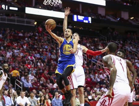 Jan 20, 2017; Houston, TX, USA; Golden State Warriors guard Stephen Curry (30) shoots a layup during the third quarter against the Houston Rockets at Toyota Center. Mandatory Credit: Troy Taormina-USA TODAY Sports