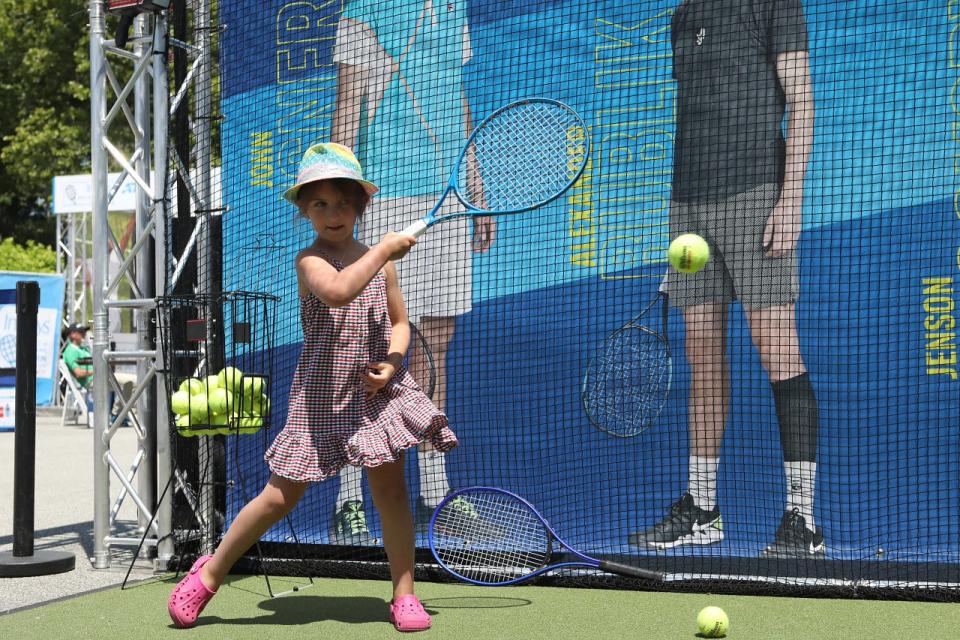 A young fan participates in the Fan Zone during the Infosys Hall of Fame Open on Sunday in Newport.