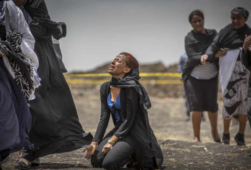 Ethiopian relatives of crash victims mourn and grieve at the scene where the Ethiopian Airlines Boeing 737 Max 8 crashed shortly after takeoff on Sunday killing all 157 on board, near Bishoftu, south-east of Addis Ababa, in Ethiopia Thursday, March 14, 2019. (Photo: Mulugeta Ayene/AP)