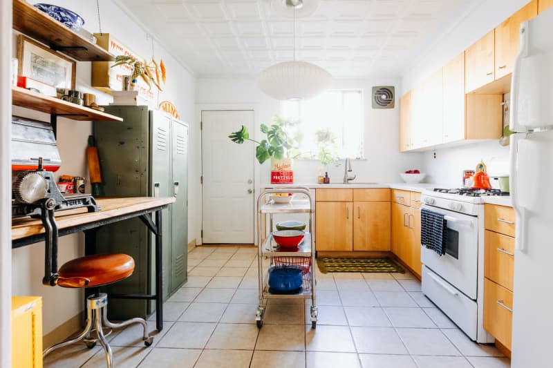 View of white kitchen with corner work space.