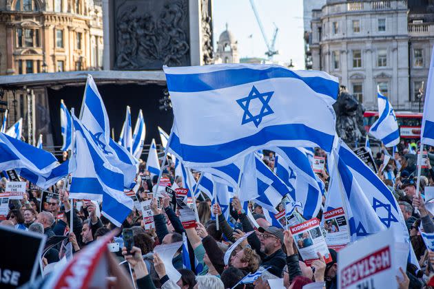  Protesters wave Israeli flags during the demonstration on the Trafalgar Square