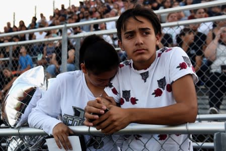 People pay their respects two days after a mass shooting in El Paso