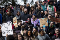 <p>Counter-protesters of an Alt-Right organized free speech event chant and hold up signs on the Boston Common on Nov. 18, 2017, in Boston, Mass. (Photo: Scott Eisen/Getty Images) </p>