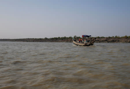 A Bangladeshi coast guard vessel approaches the Thengar Charan island in the Bay of Bengal, Bangladesh, February 2, 2017. Picture taken February 2, 2017. REUTERS/Mohammad Ponir Hossain