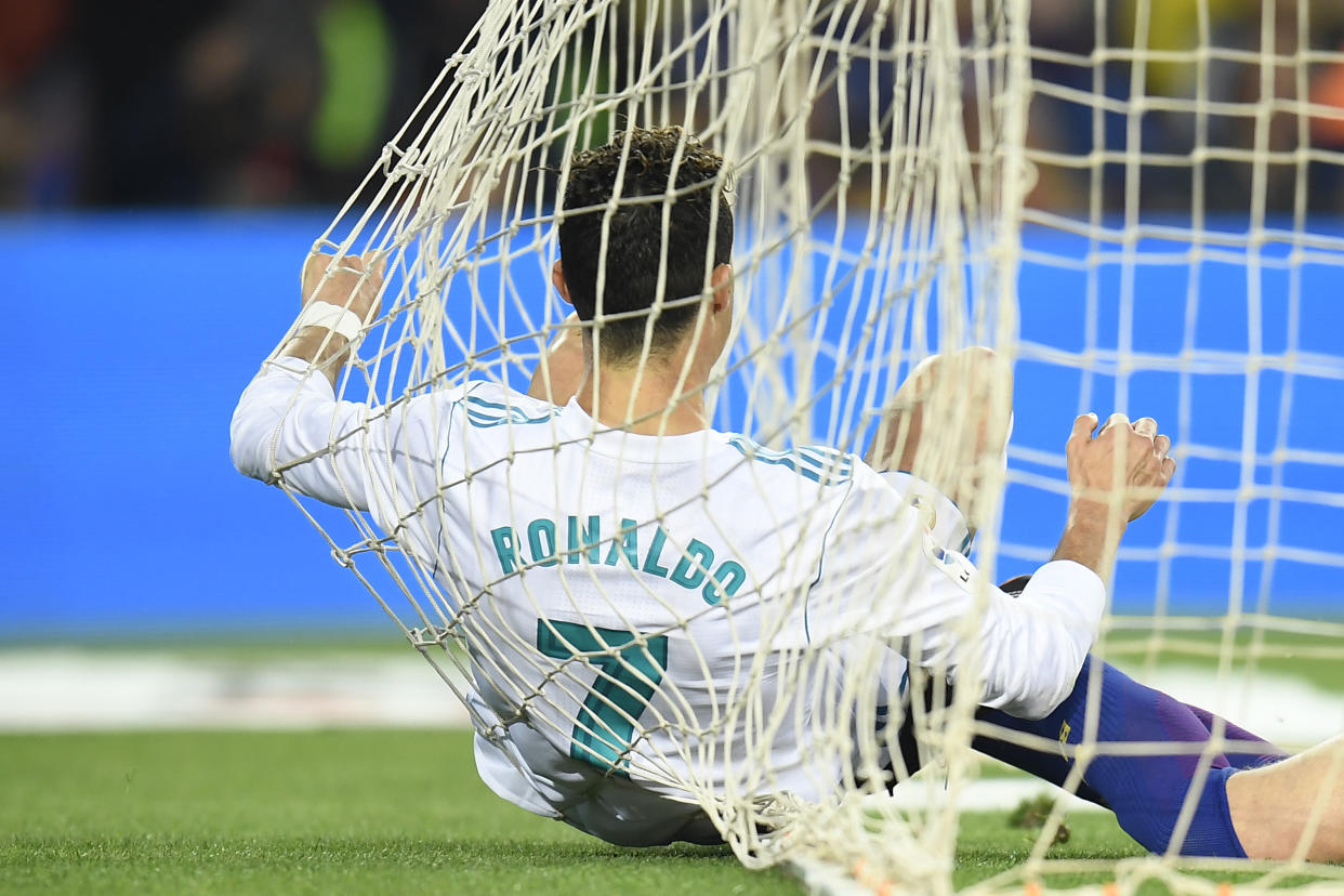 Cristiano Ronaldo flew into the net after scoring for Real Madrid against Barcelona. (Getty)