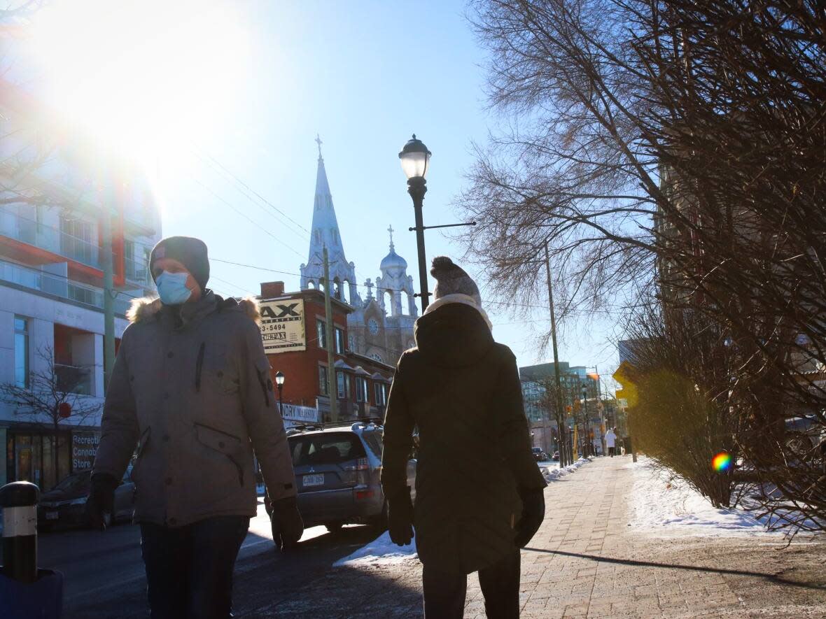 People walk along Wellington Street West in Ottawa earlier this week. (Trevor Pritchard/CBC - image credit)