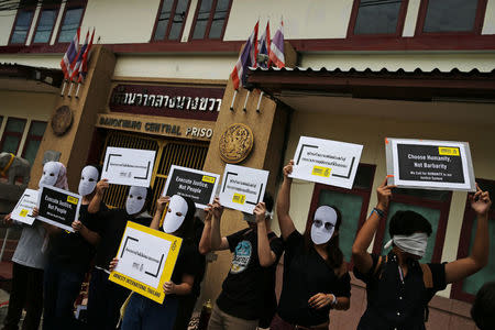 Demonstrators from Amnesty International hold placards outside the Bang Kwang Central Prison to protest against the death penalty in Bangkok, Thailand, June 19, 2018. REUTERS/Athit Perawongmetha1