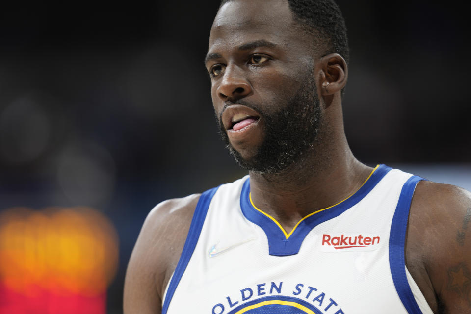 Golden State Warriors forward Draymond Green (23) in the second half of Game 3 of an NBA basketball first-round Western Conference playoff series Thursday, April 21, 2022, in Denver.  (AP Photo/David Zalubowski)