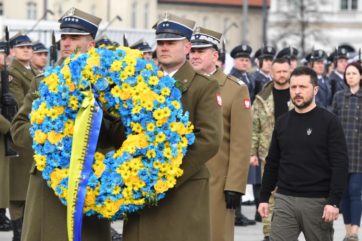 Ukrainian President Volodymyr Zelenski (R) attends a wreath laying ceremony at the Pilsudski Square in Warsaw, Poland (EPA)
