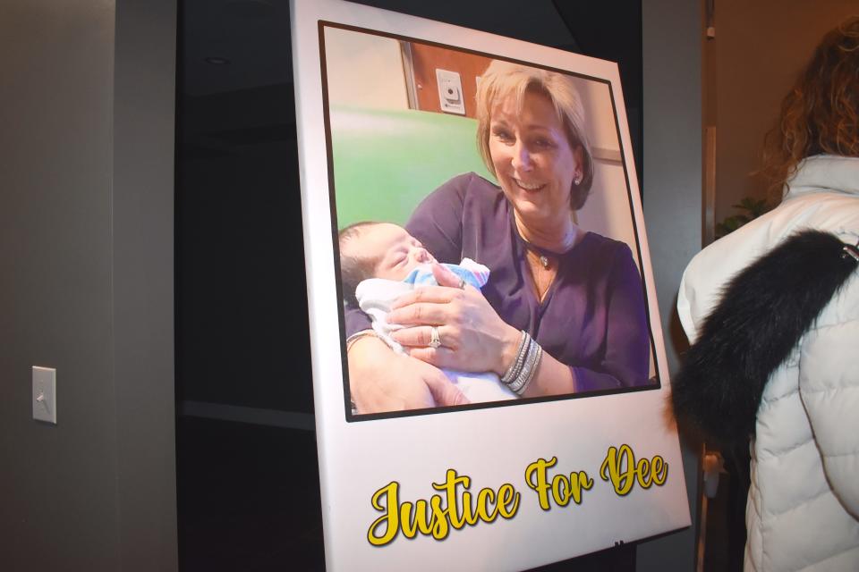 An image of Dee Warner is shown inside the Hardy Farms barn Saturday during a community vigil held in honor of Warner. The Tipton woman has been missing since April 25 and the community is seeking "justice for Dee."