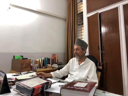 Masood Ahmad Khalid, a member of Ahmadi community, speaks during an interview with Reuters at his office in the town of Rabwah, Pakistan July 9, 2018. Picture taken July 9, 2018. REUTERS/Saad Sayeed