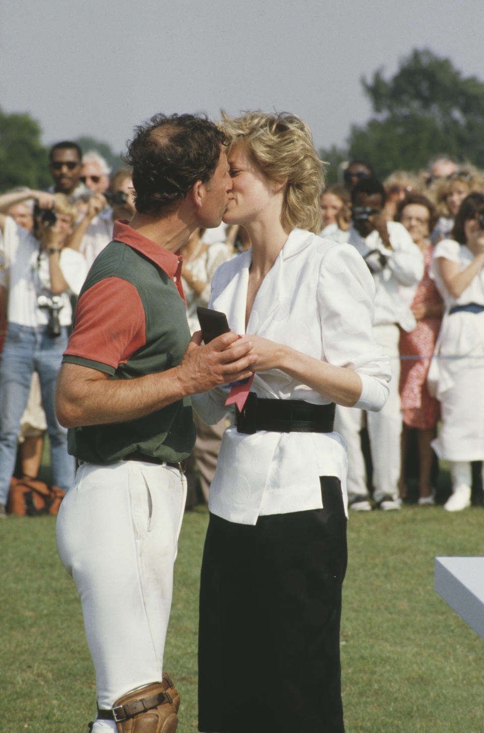 Diana and Charles share a kiss at the Polo Club in Windsor. (Getty Images)