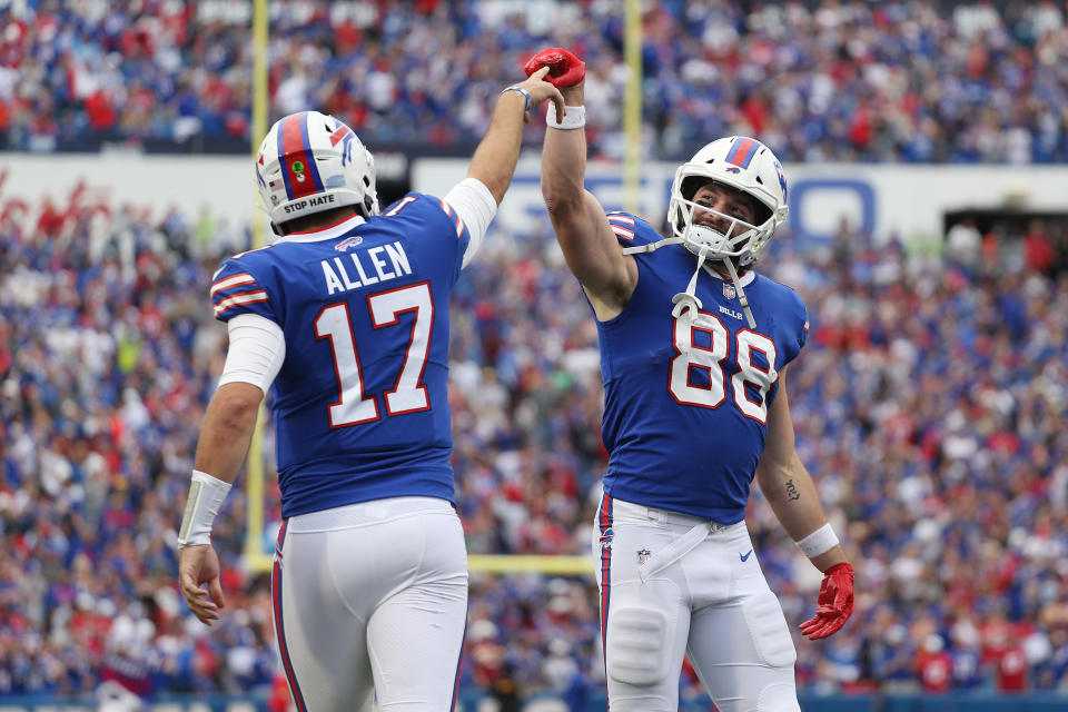 ORCHARD PARK, NEW YORK - SEPTEMBER 26: Quarterback Josh Allen #17 and Dawson Knox #88 of the Buffalo Bills celebrate after a rushing touchdown by Allen during the fourth quarter of the game against the Washington Football Team at Highmark Stadium on September 26, 2021 in Orchard Park, New York. (Photo by Joshua Bessex/Getty Images)