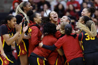 Southern California celebrates a win after an NCAA college basketball game against Stanford on Friday, Feb. 2, 2024 in Stanford, Calif. (AP Photo/Josie Lepe)