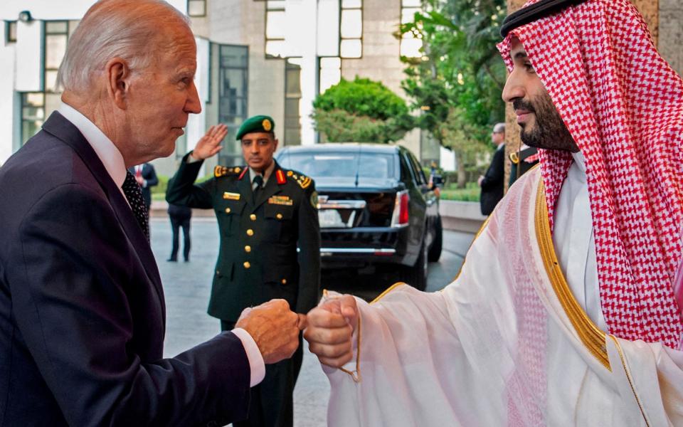 Saudi Crown Prince Mohammed bin Salman (R) bumps fists with US President Joe Biden at Al-Salam Palace in the Red Sea port of Jeddah - GETTY IMAGES