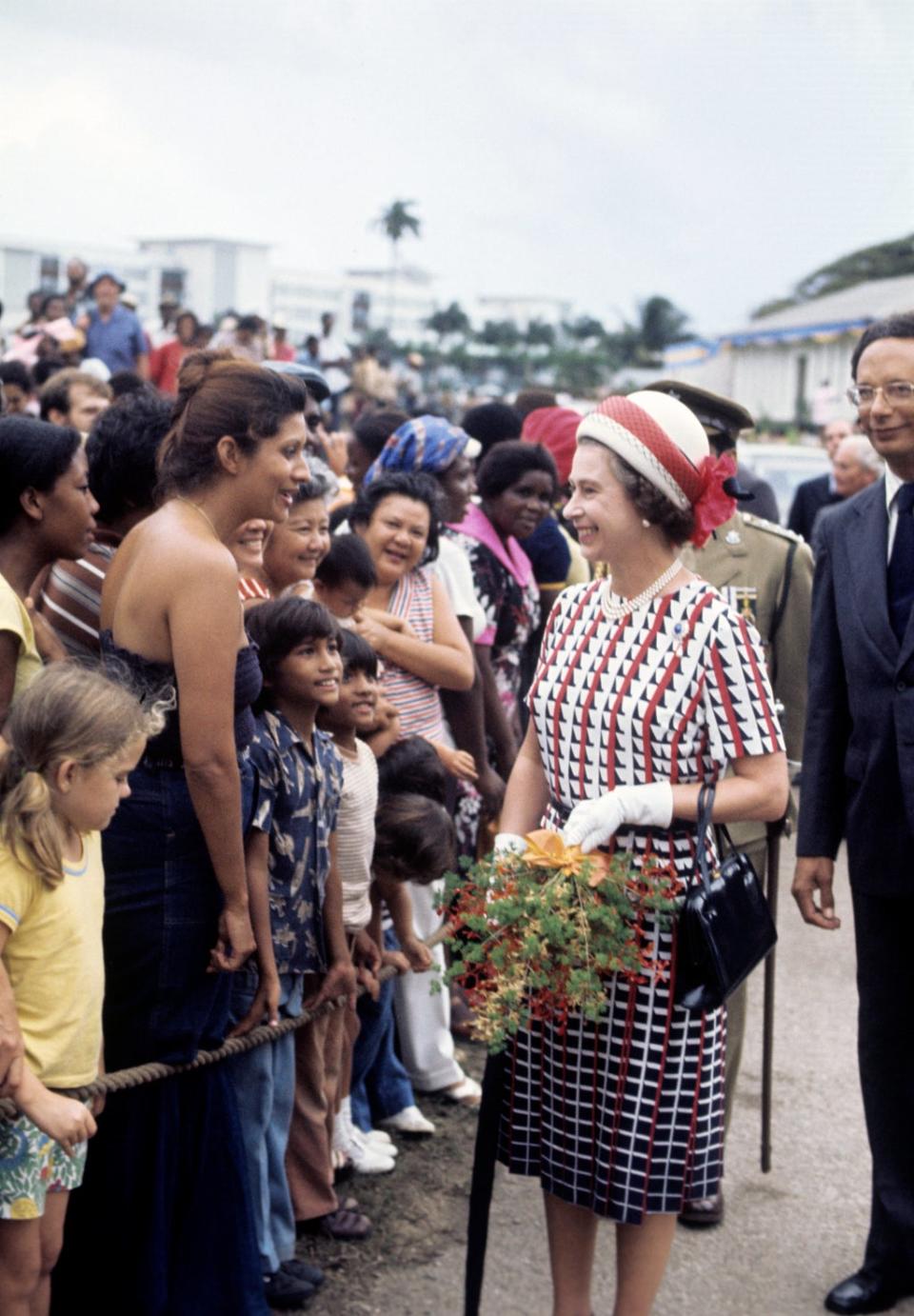 The Queen during a walkabout in Bridgetown, Barbados, during her silver jubilee tour of the Caribbean (Ron Bell/PA) (PA Archive)