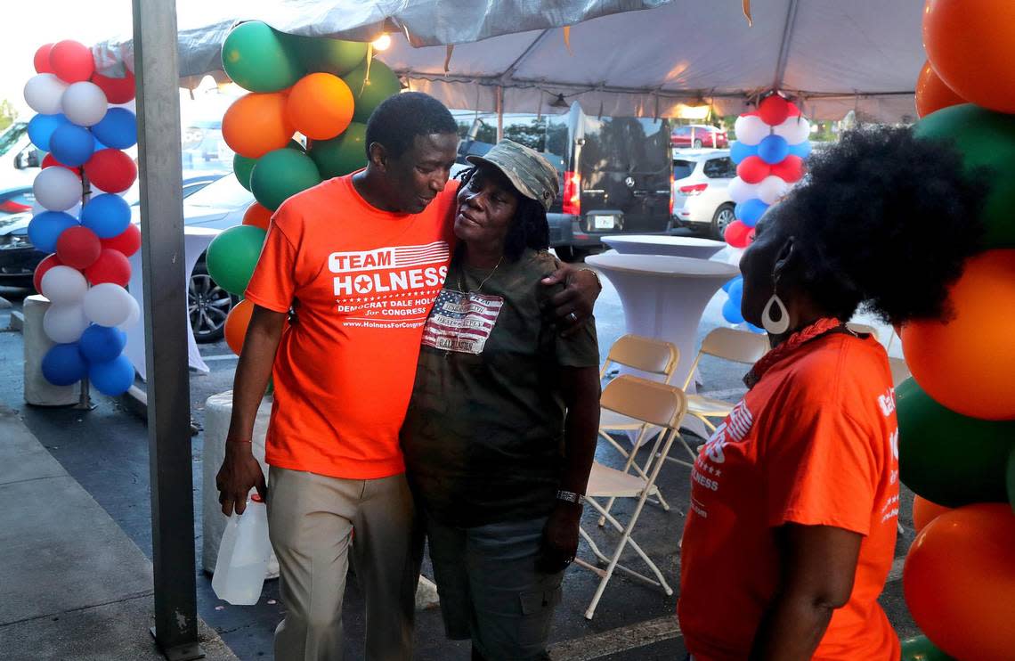 Dale Holness, a Democratic candidate running for Florida’s 20th Congressional District, is greeted by campaign volunteer Clover Haynes at his campaign headquarters in Plantation, Florida, on Tuesday Aug. 23, 2022, shortly after the polls closed. Holness lost.