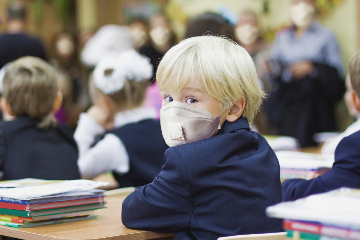 Child boy student in protective mask, back to school