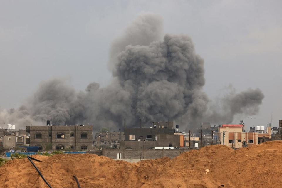 Smoke rises over buildings in Khan Yunis during Israeli bombardment on Feb. 2, 2024, as fighting continues between Israel and the Palestinian Hamas group in Gaza.