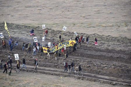 Protester gather near a pipeline being built by a group of companies led by Energy Transfer Partners LP at a construction site in North Dakota before being confronted by police October 22, 2016, Photo courtesy Morton County Sheriff's Office/Handout via REUTERS