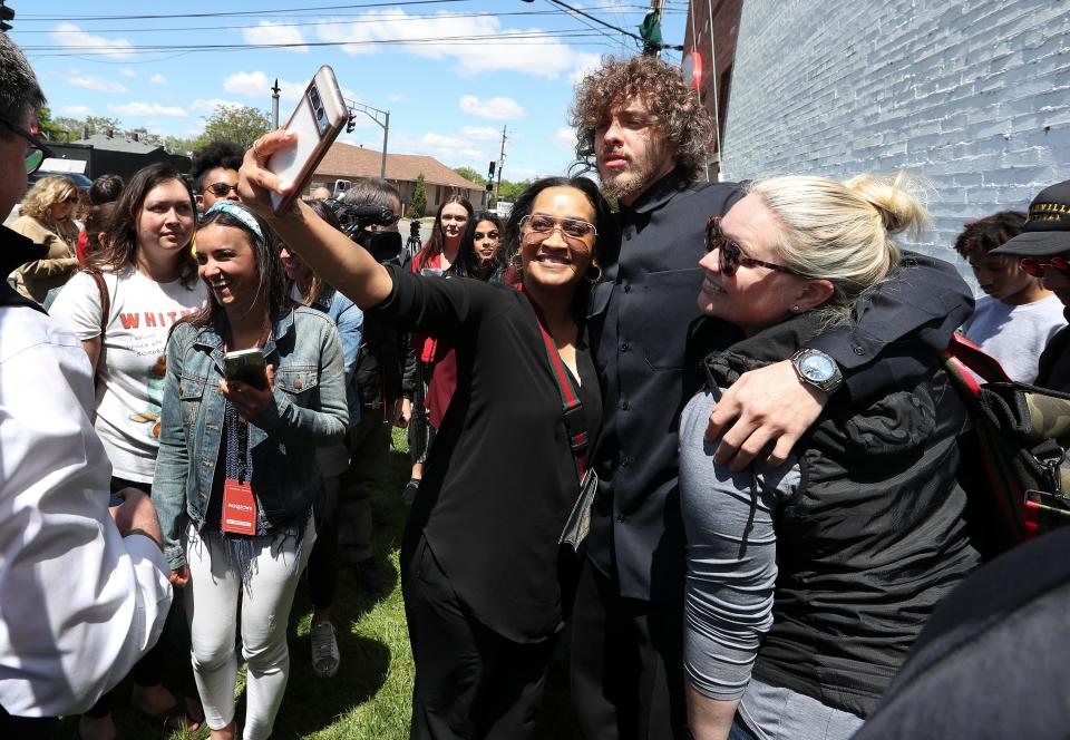 Rap music star and Louisvillian Jack Harlow posed for photos with fans after he was honored during the unveiling of a Hometown Heroes banner on the side of the A-OK Storage Building at the corner of Broadway and Barrett Ave. in Louisville, Ky. on May 3, 2023.  The event was attended by local and state dignitaries.