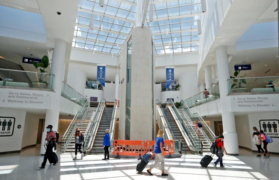 Passengers arrive at Daytona Beach International Airport on July 26, 2021. The airport was built in 1992 after advocacy by Big John.