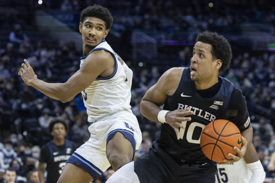 Butler forward Bryce Nze (10) grabs a rebound away from Villanova forward Jermaine Samuels (23) during the first half of an NCAA college basketball game, Sunday, Jan. 16, 2022, in Philadelphia, Pa. (AP Photo/Laurence Kesterson)