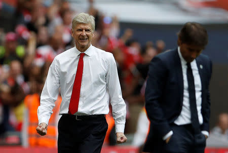 Britain Soccer Football - Arsenal v Chelsea - FA Cup Final - Wembley Stadium - 27/5/17 Arsenal manager Arsene Wenger celebrates after Aaron Ramsey (not pictured) scores their second goal as Chelsea manager Antonio Conte looks dejected Action Images via Reuters / Lee Smith