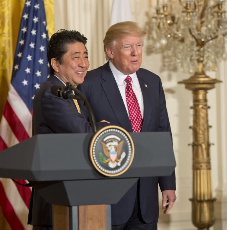 Shinzo Abe and Donald Trump during their US meeting in Feb (Rex)