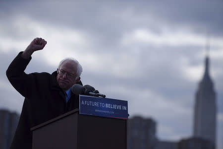 The Empire State Building is seen in the background from Transmitter Park as U.S. Democratic presidential candidate and Senator Bernie Sanders gestures during a campaign rally in the Brooklyn borough of New York April 8, 2016. REUTERS/Darren Ornitz