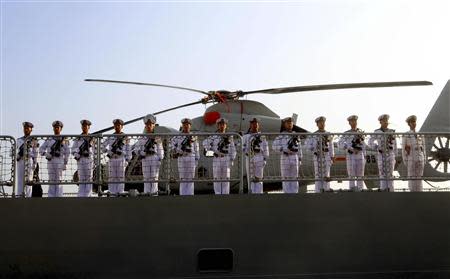 Chinese sailors stand at attention as the Chinese frigate Yancheng comes in to dock at Limassol port, January 4, 2014. REUTERS/Andreas Manolis