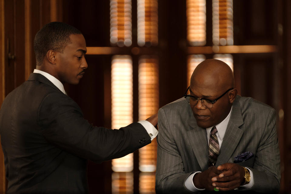 This image released by Apple TV Plus shows Samuel L. Jackson, right, and Anthony Mackie in a scene from "The Banker." (Apple TV Plus via AP)