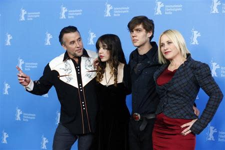 Director, screenwriter and producer Richard Linklater and cast members Lorelei Linklater, Ellar Coltrane and Patricia Arquette (L-R) pose during a photocall to promote the movie "Boyhood" during the 64th Berlinale International Film Festival in Berlin February 13, 2014. REUTERS/Tobias Schwarz