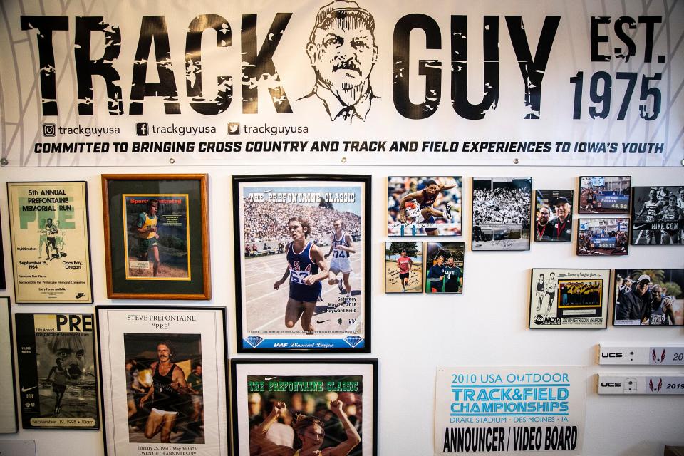 A Track Guy poster is displayed in the garage of Mike Jay, Wednesday, April 20, 2022, in Tiffin, Iowa.