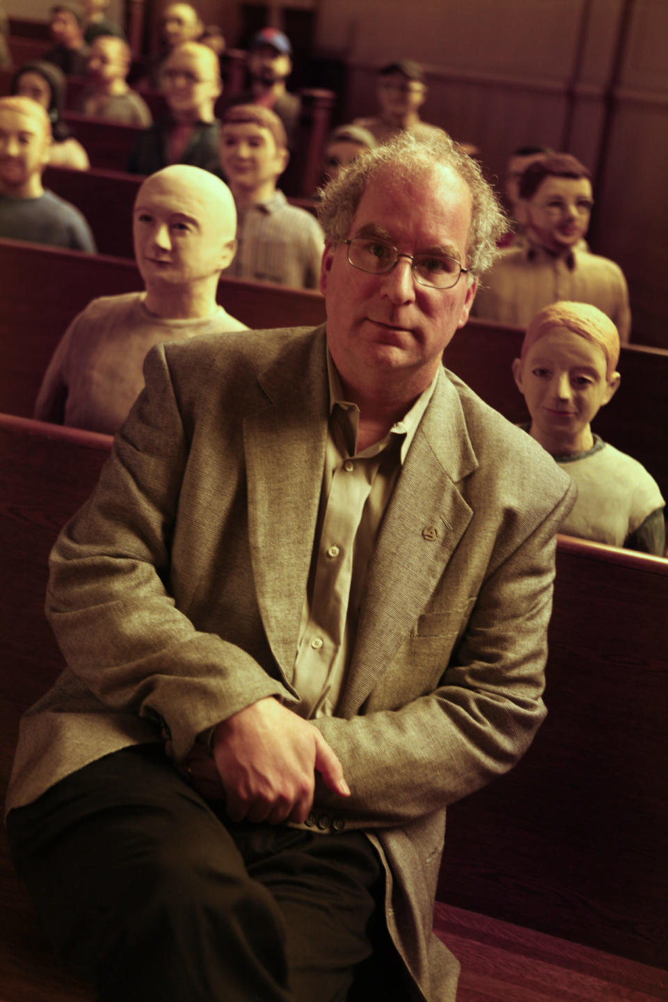 Brewster Kahle, sitting with some of the 