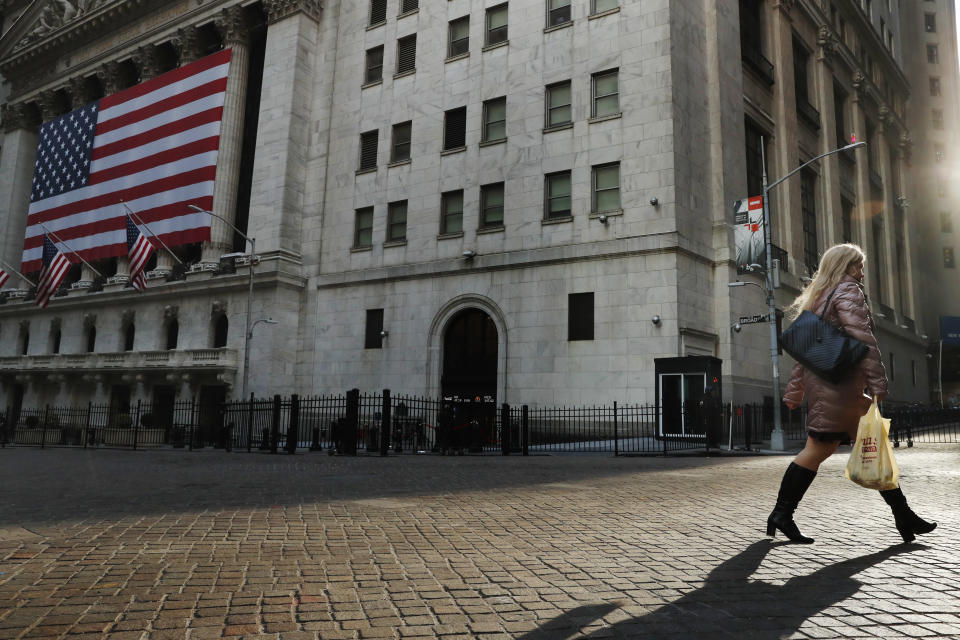 FTSE A pedestrian walks on Wall St., as concerns about coronavirus disease (COVID-19) keep more people at home, in front of the New York Stock Exchange (NYSE) in New York, U.S., March 18, 2020. REUTERS/Lucas Jackson