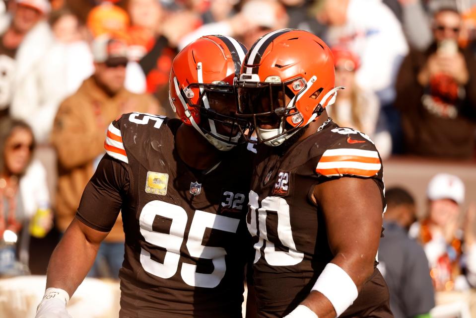 Cleveland Browns defensive end Myles Garrett (95) is congratulated by defensive tackle Maurice Hurst II (90) after recovering a fumble against the Arizona Cardinals on Nov. 5, 2023, in Cleveland.