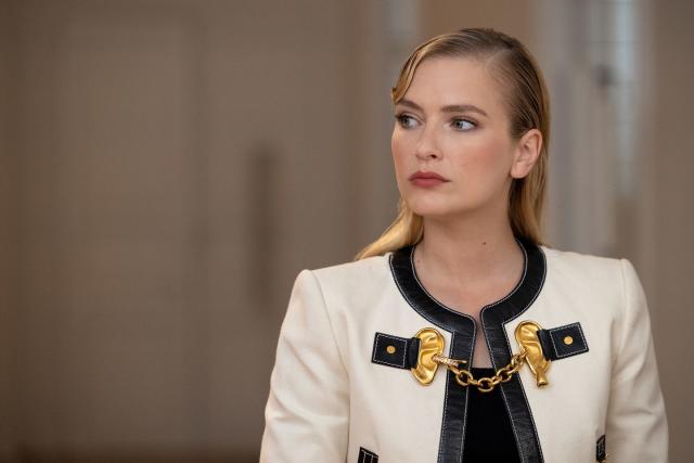 Chanel's white jacket and skirt set with black trim and gold buttons on  Scream Queens