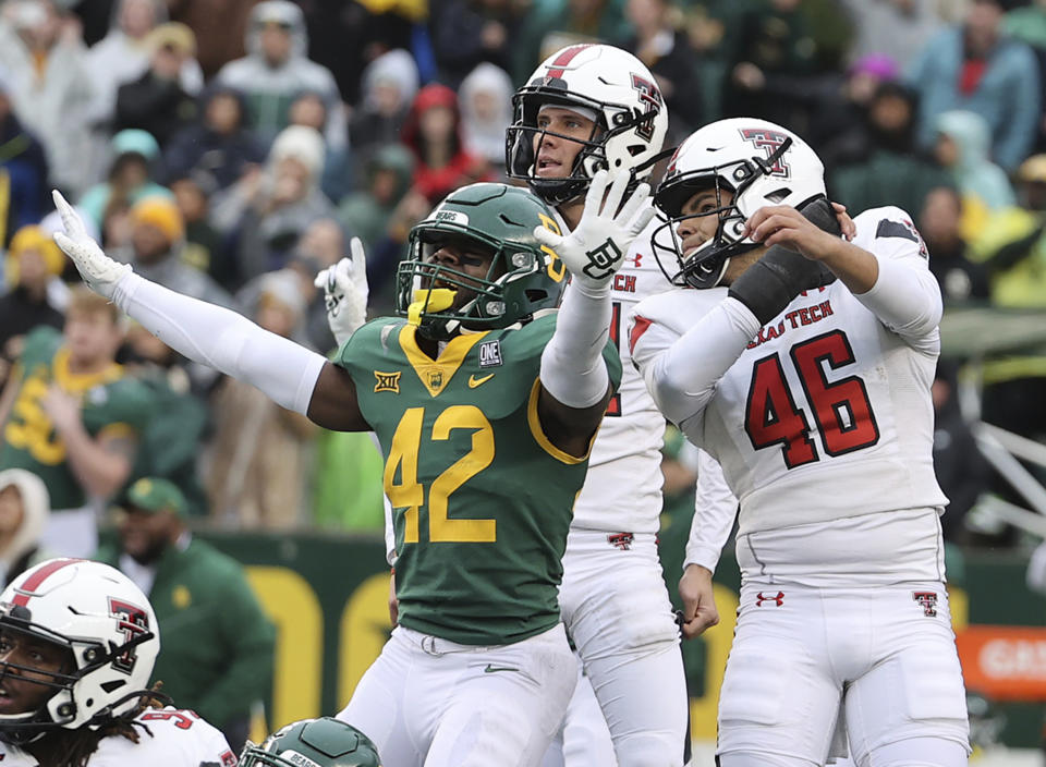 Baylor safety Jairon McVea reacts as Texas Tech place kicker Jonathan Garibay watches his field goal attempt miss in the final seconds of an NCAA college football game Saturday, Nov. 27, 2021, in Waco, Texas. (AP Photo/Jerry Larson)