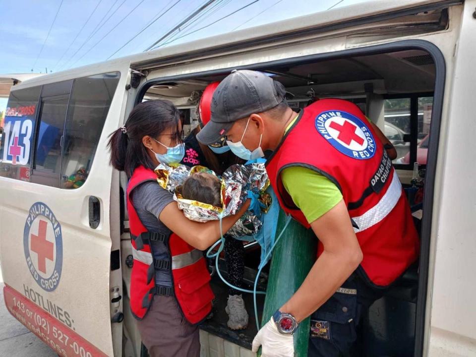 Rescuers save three-year-old girl trapped under Philippines landslide rubble and mud for over 60 hours (Philippine Red Cross)