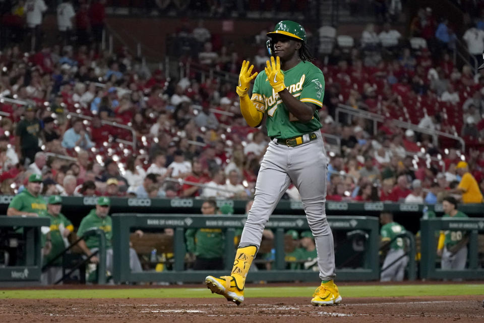 Oakland Athletics' Lawrence Butler celebrates as he arrives home after hitting a two-run home run during the seventh inning of a baseball game against the St. Louis Cardinals Tuesday, Aug. 15, 2023, in St. Louis. (AP Photo/Jeff Roberson)